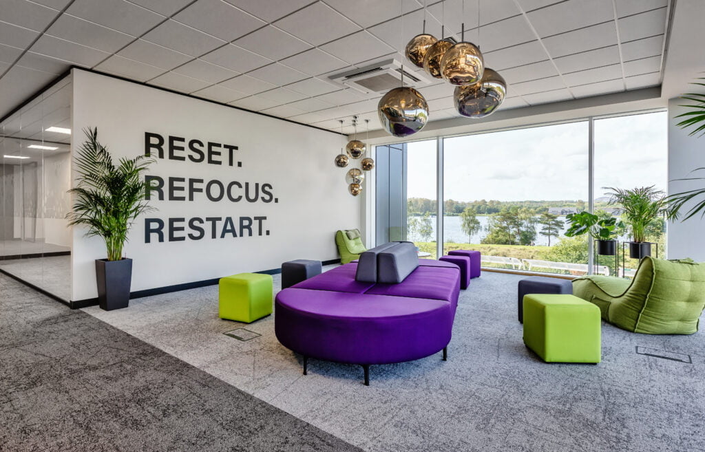 cosy breakout area, hanging lights, green and purple seating