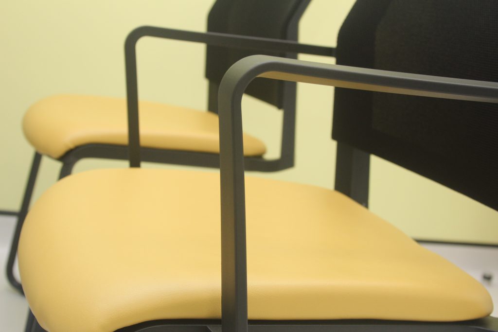 close up of yellow and black chairs