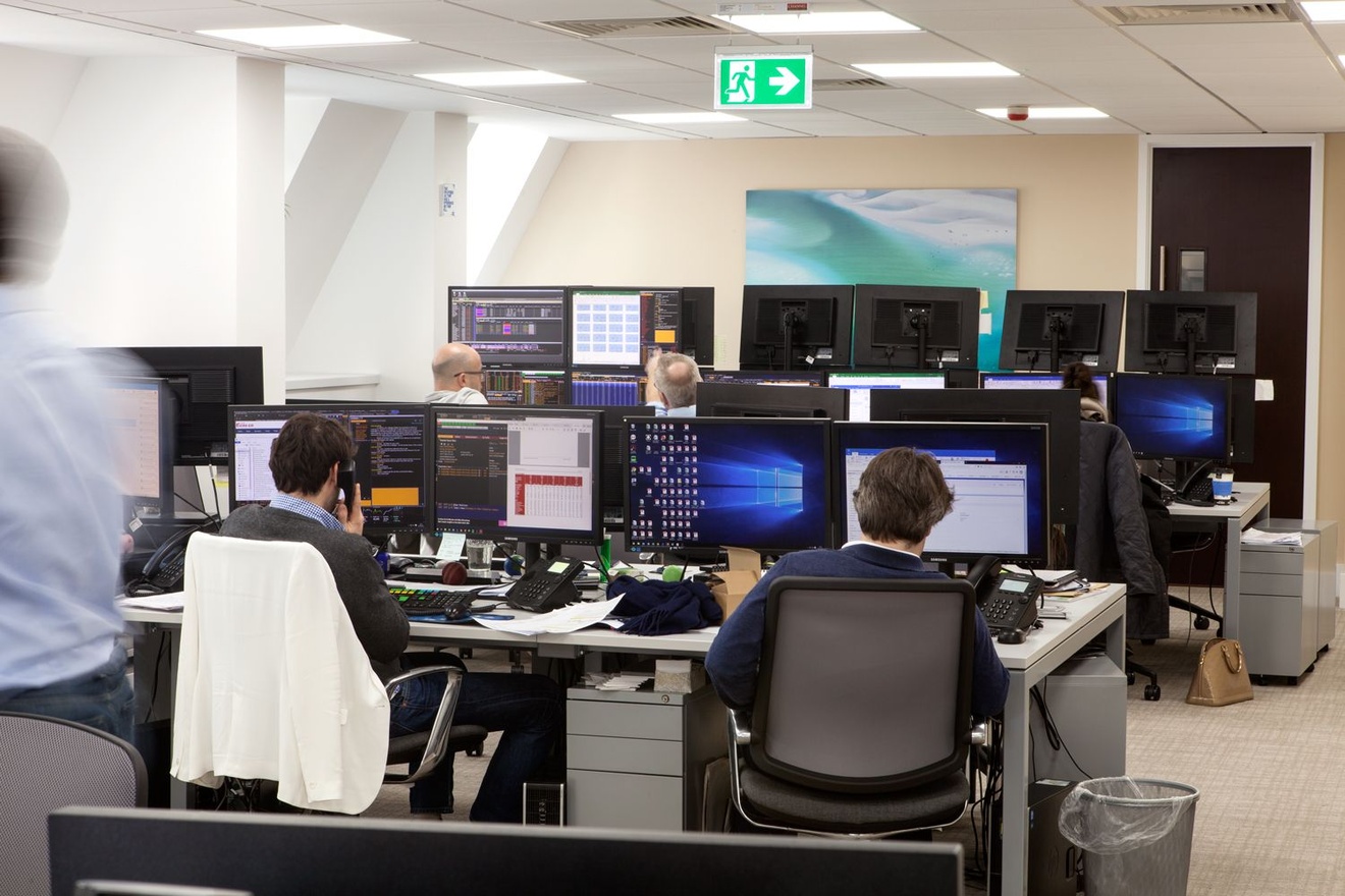 Employees sat at desks working.