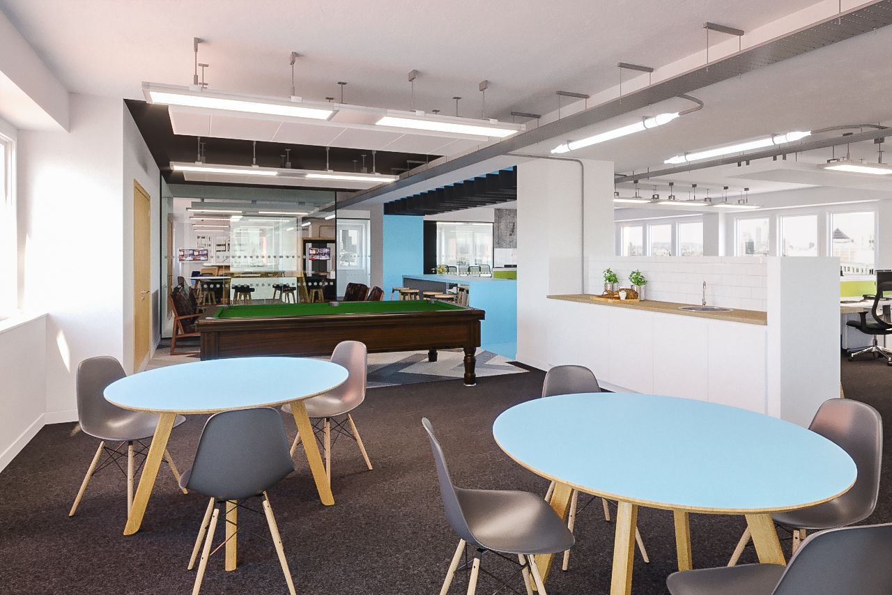 An office space with a counter top, a pool table and tables with chairs.