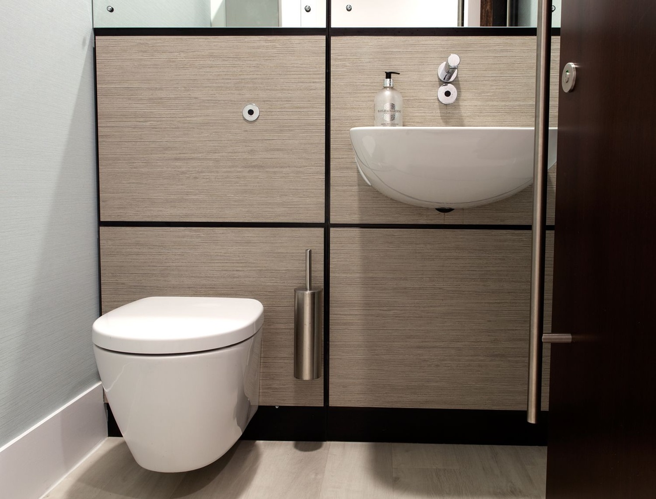 A bathroom with a toilet and a sink.