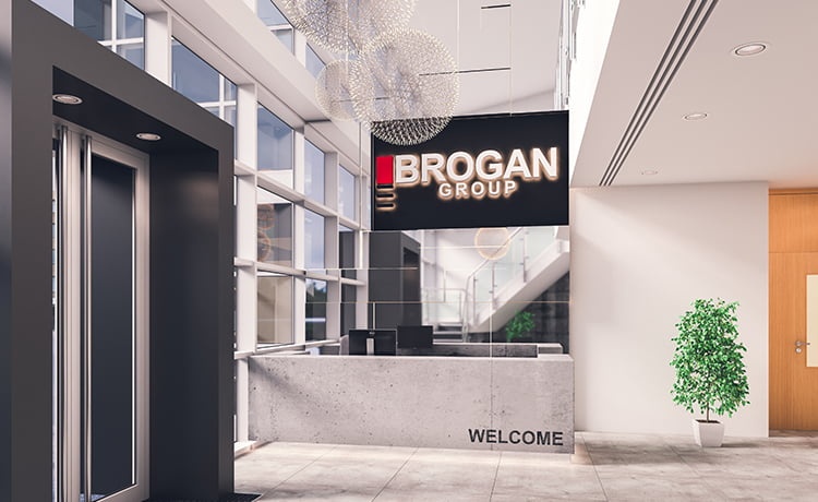 Modern office reception area with large logo sign