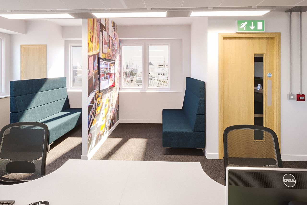 A thin wall with a television on it and two sofas either side of it.