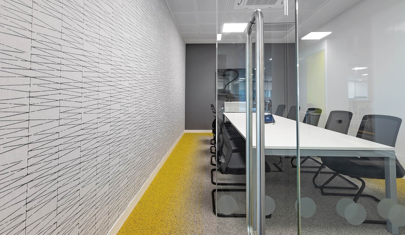 Looking through a glass door into a boardroom.