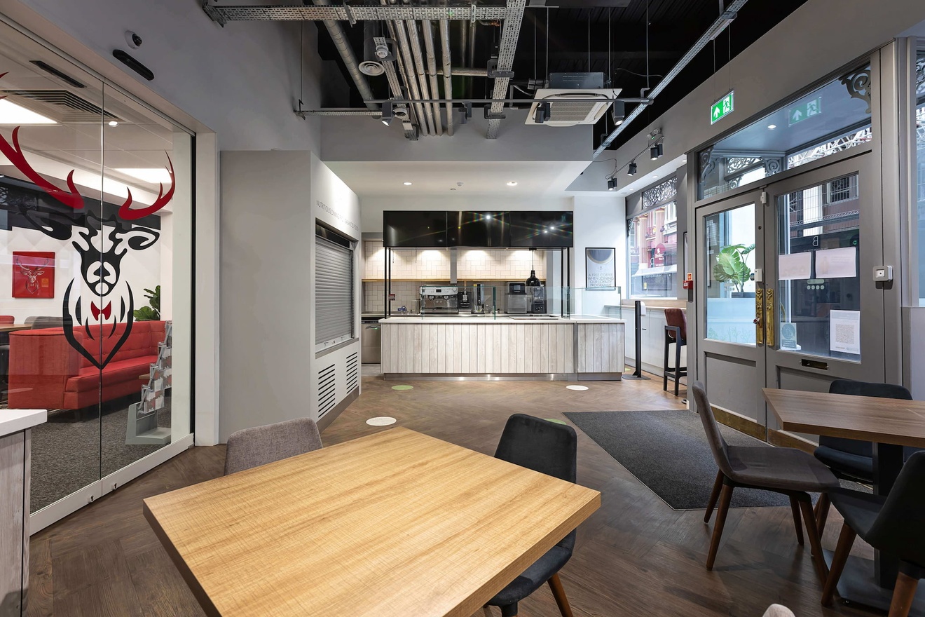 A cafe attached to an office with a coffee machine.