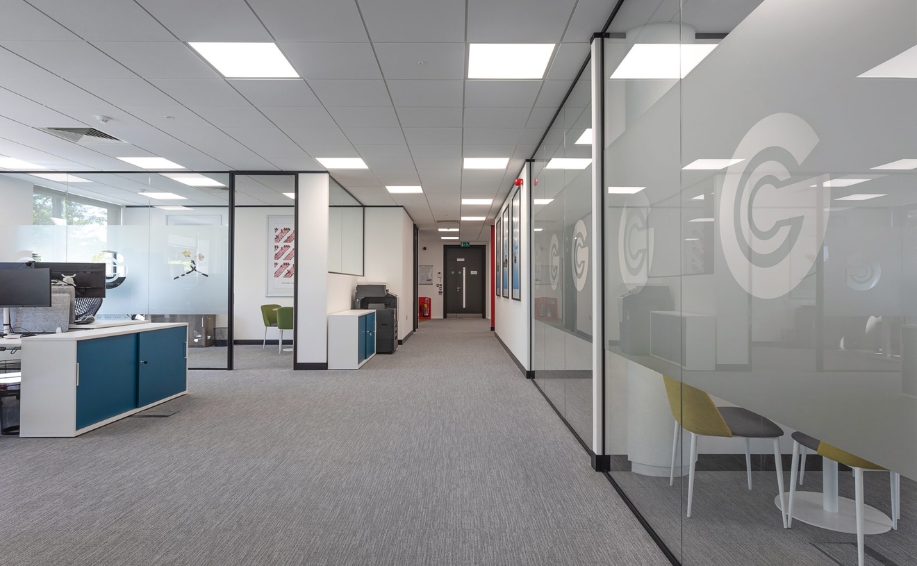GCT modern open plan office design in Watford with branded glass walls